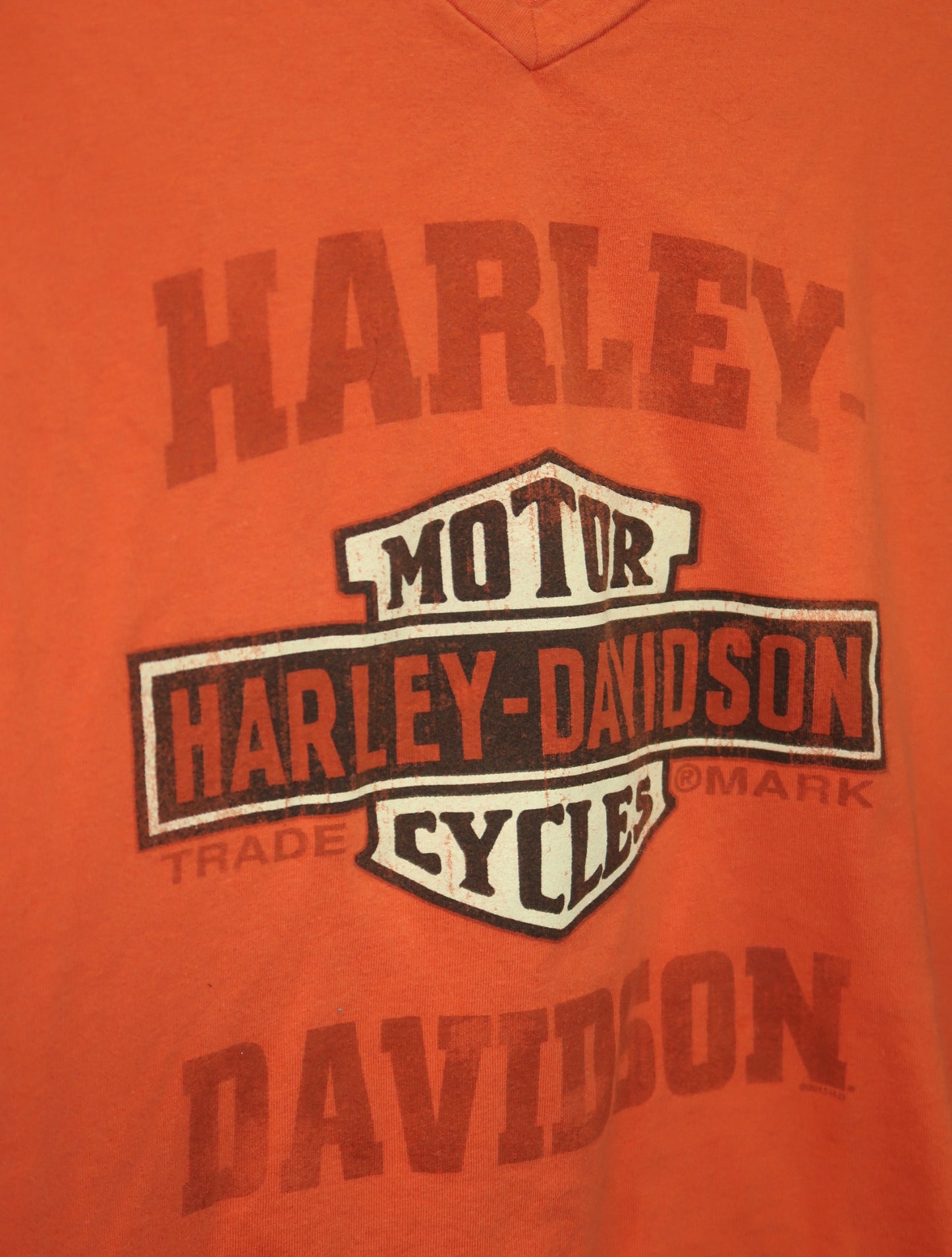 (L) Harley Davidson orange graphic top